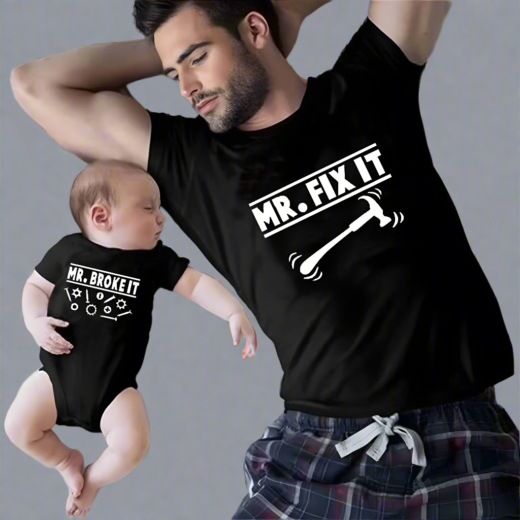 Father and baby wearing matching 'Mr. Fix It' and 'Mr. Broke It' shirts