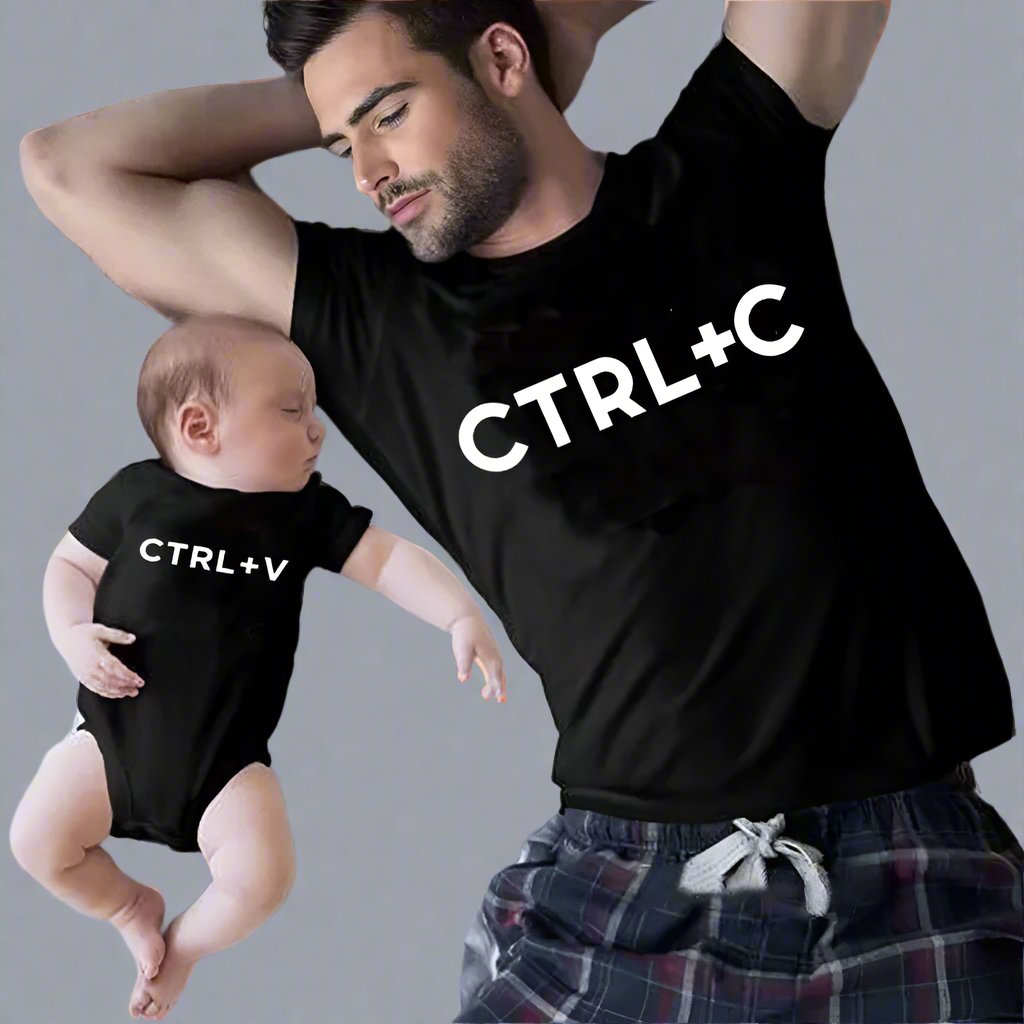 Dad and baby wearing matching shirts with CTRL+C and CTRL+V, symbolizing copy and paste
