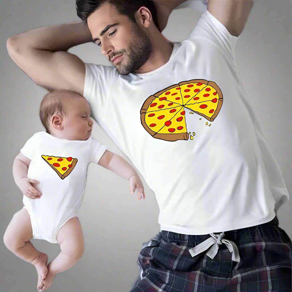 Dad and baby wearing matching pizza-themed T-shirts, dad with a whole pizza and baby with a slice"