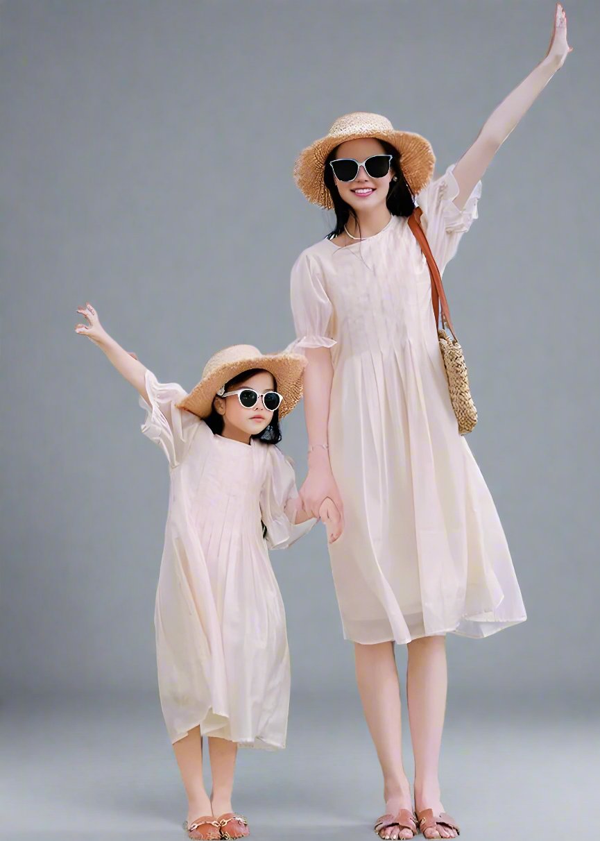 Matching beige summer dresses for mom and daughter