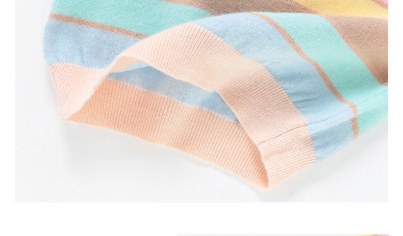 Mother and daughter wearing cozy pastel striped cardigans