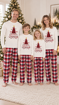 Family in matching ivory Christmas pajama tops with a buffalo plaid tree and MERRY Christmas lettering, worn with red and black plaid pants.