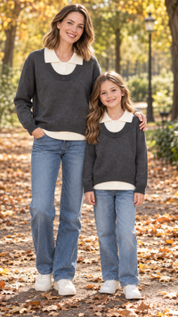 Mom and daughter in matching charcoal knit sweaters with cream collars.
