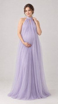 Pregnant woman in a lavender halter mesh maternity gown in a photo studio