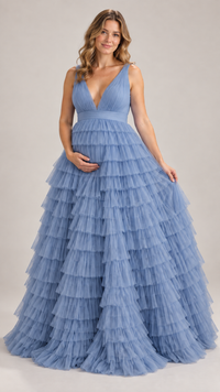 Pregnant woman in a dusty blue deep-V tiered ruffle tulle gown in a photo studio