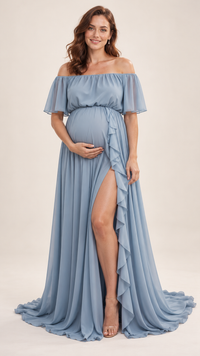 Pregnant woman in a dusty blue ruffle slit off-shoulder maternity gown in a photo studio
