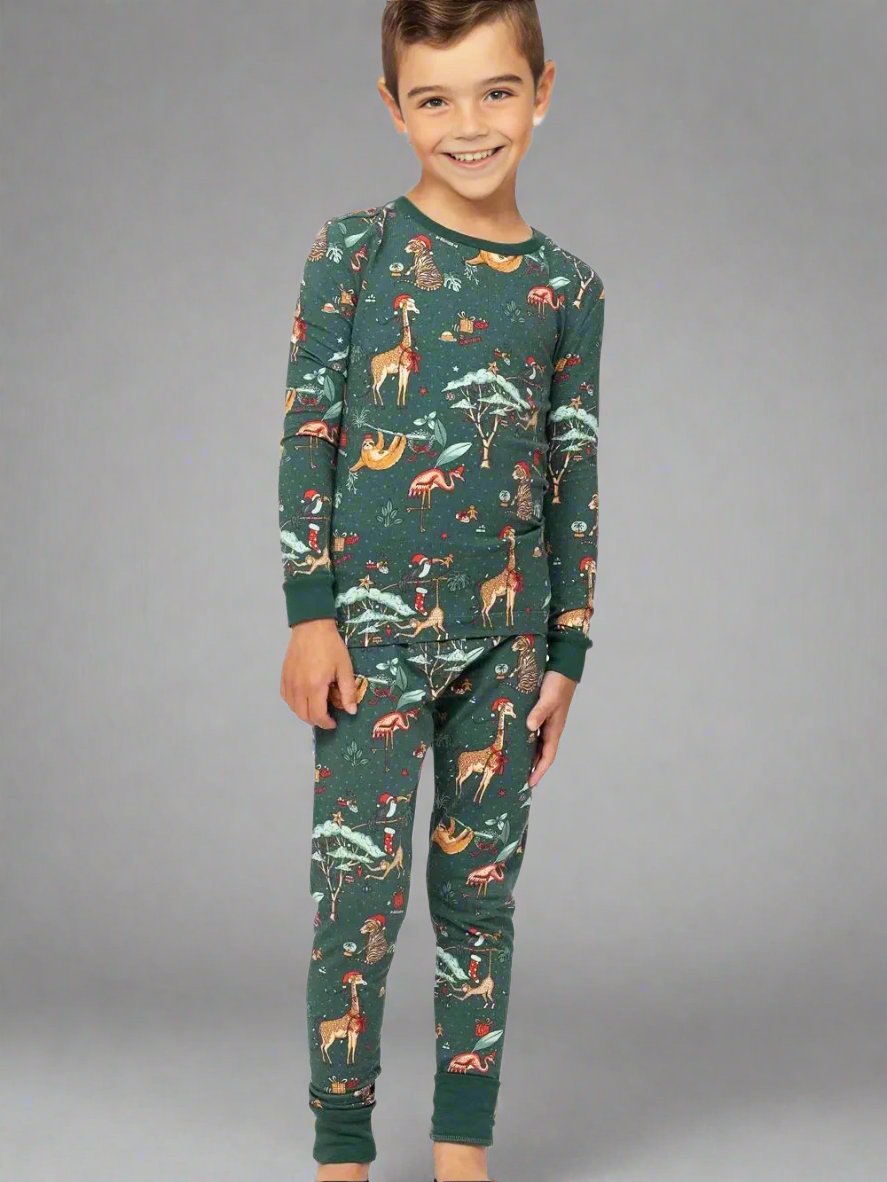 Matching family Christmas pajamas with green forest animal print for holiday season