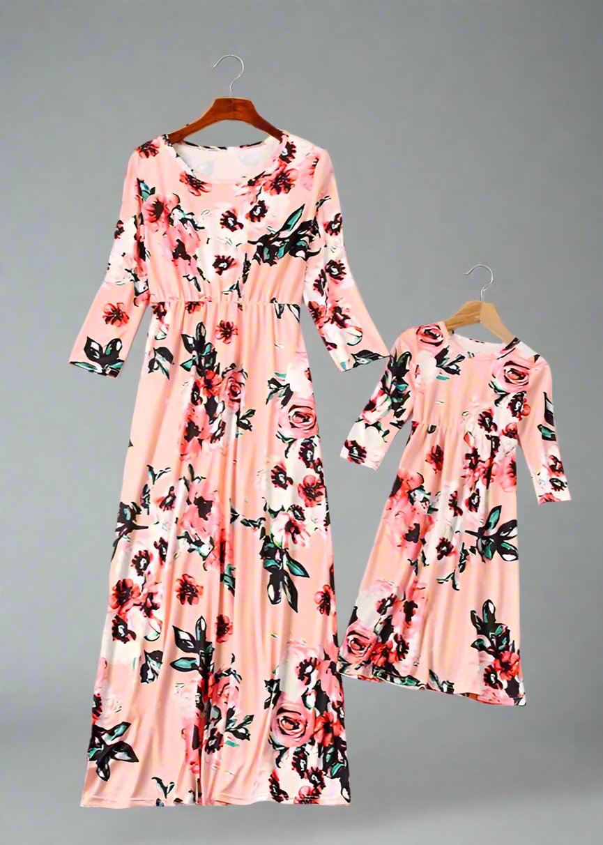 Mother and daughter wearing coordinated pink floral maxi dresses, styled for any occasion