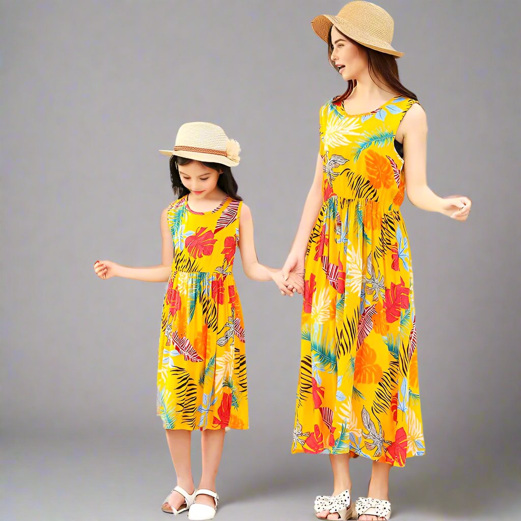 Yellow tropical print matching sundresses for mother and daughter