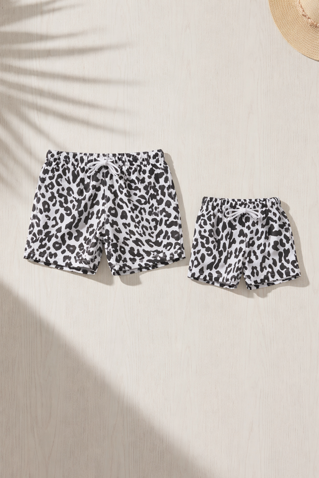 Alternate image of family matching swim trunks with animal print