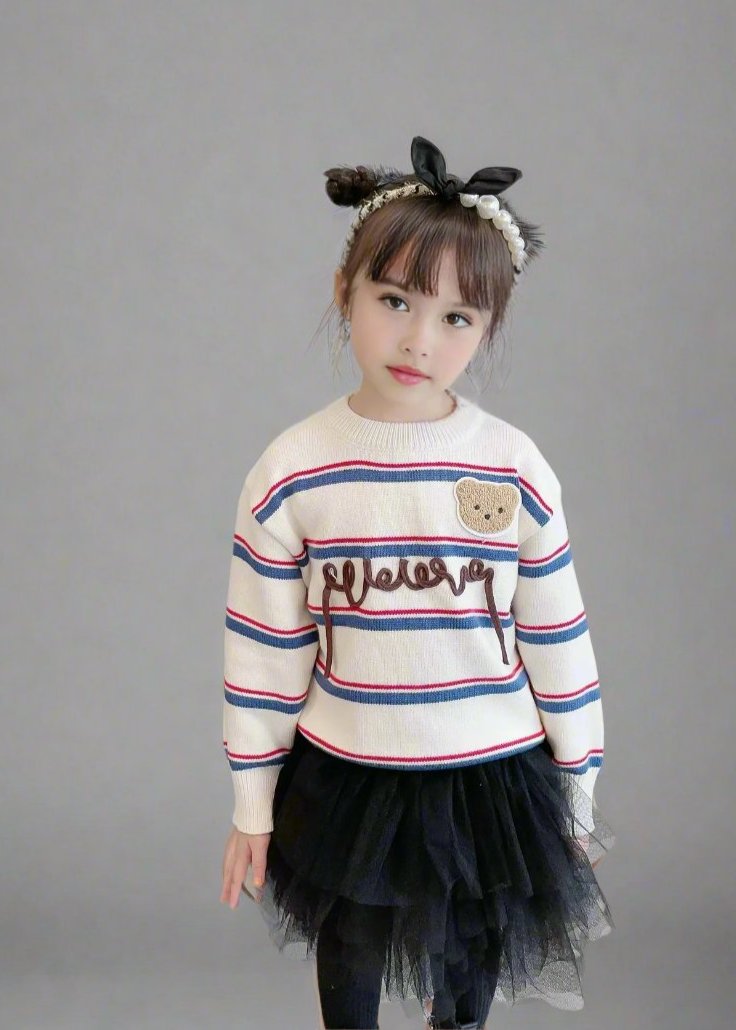 Cozy holiday family sweater with 'Cheers' script and bear detail