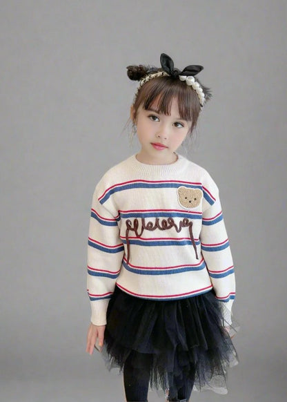 Cozy holiday family sweater with 'Cheers' script and bear detail