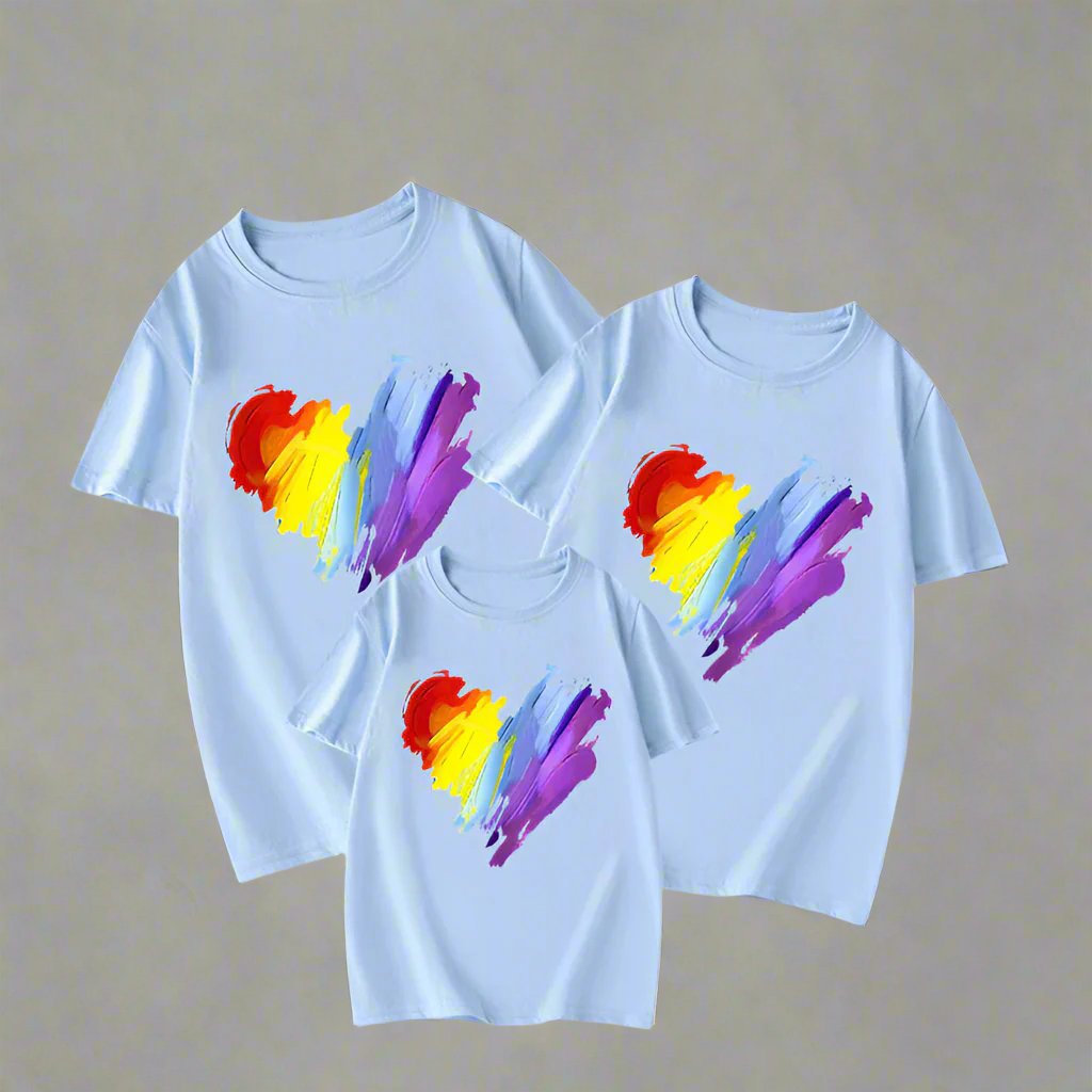 Matching family t-shirts with abstract rainbow heart design in white, yellow, and red options