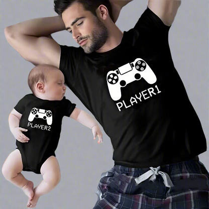 Father and baby wearing matching 'Player 1' and 'Player 2' gaming T-shirts