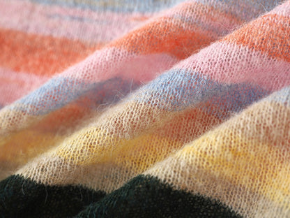 Family matching sweaters with colorful pastel horizontal stripes