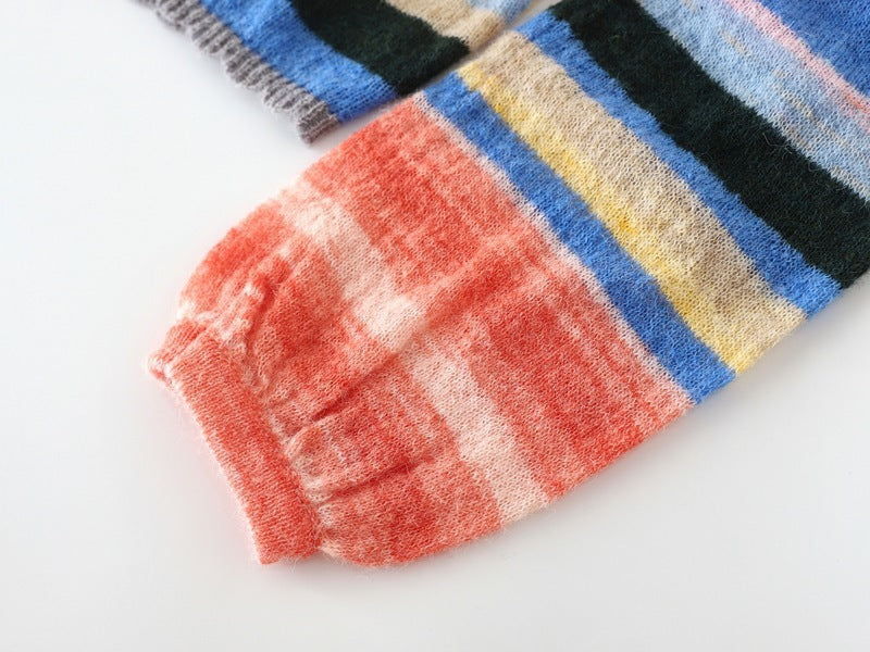 Family matching sweaters in soft knit with warm coral, blue, yellow, and green stripe