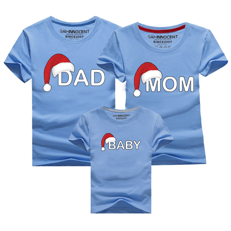 Blue matching family t-shirts for Christmas with Santa hat graphics and labels for Dad, Mom, and Baby