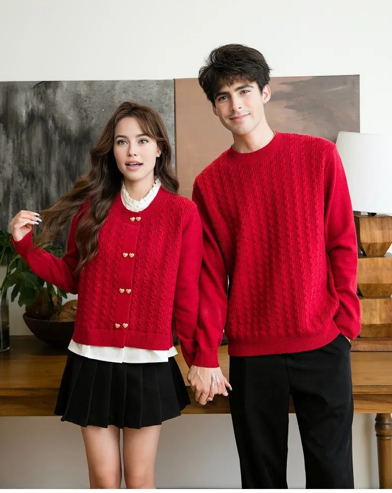 Couple holding hands in matching red cable knit sweaters, styled for coordinated couple outfits
