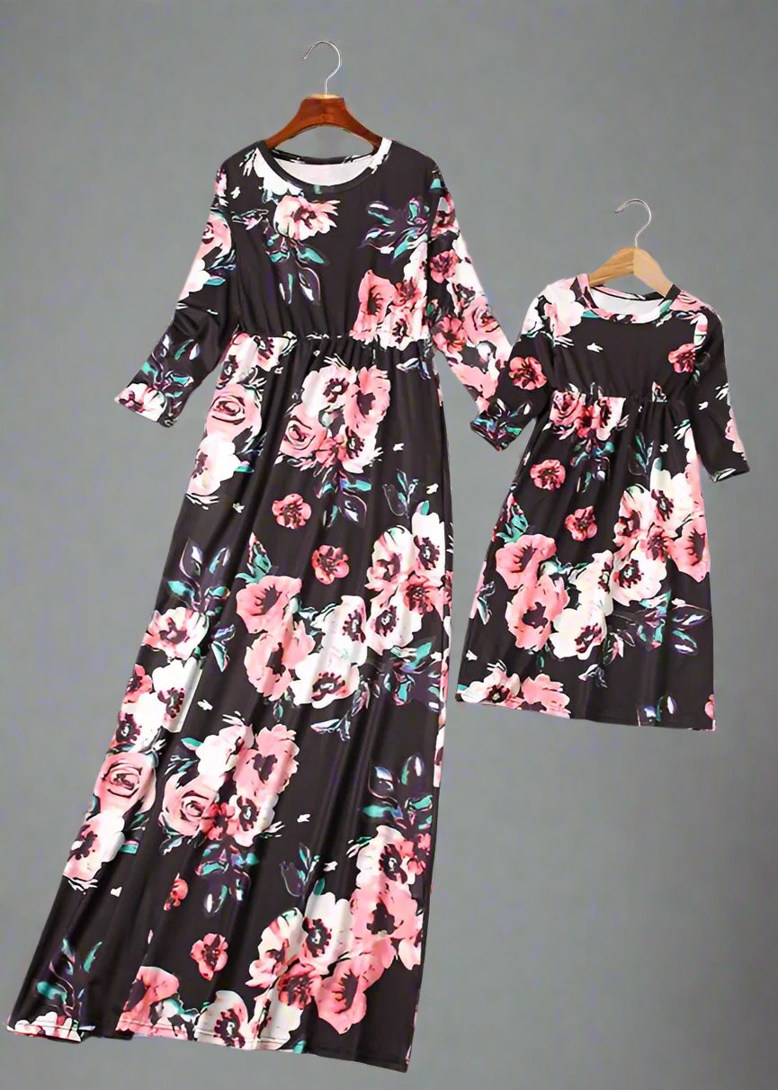 Elegant matching floral maxi dresses for mom and daughter, styled for family outing