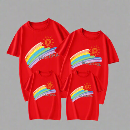 Family matching shirts with a colorful rainbow and 'Beautiful' text design