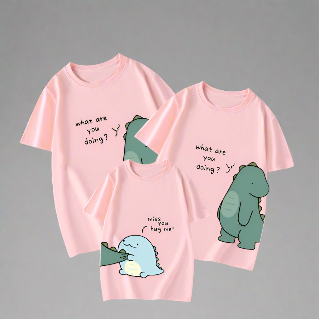 Pink family matching outfits with dinosaur illustrations and sweet messages