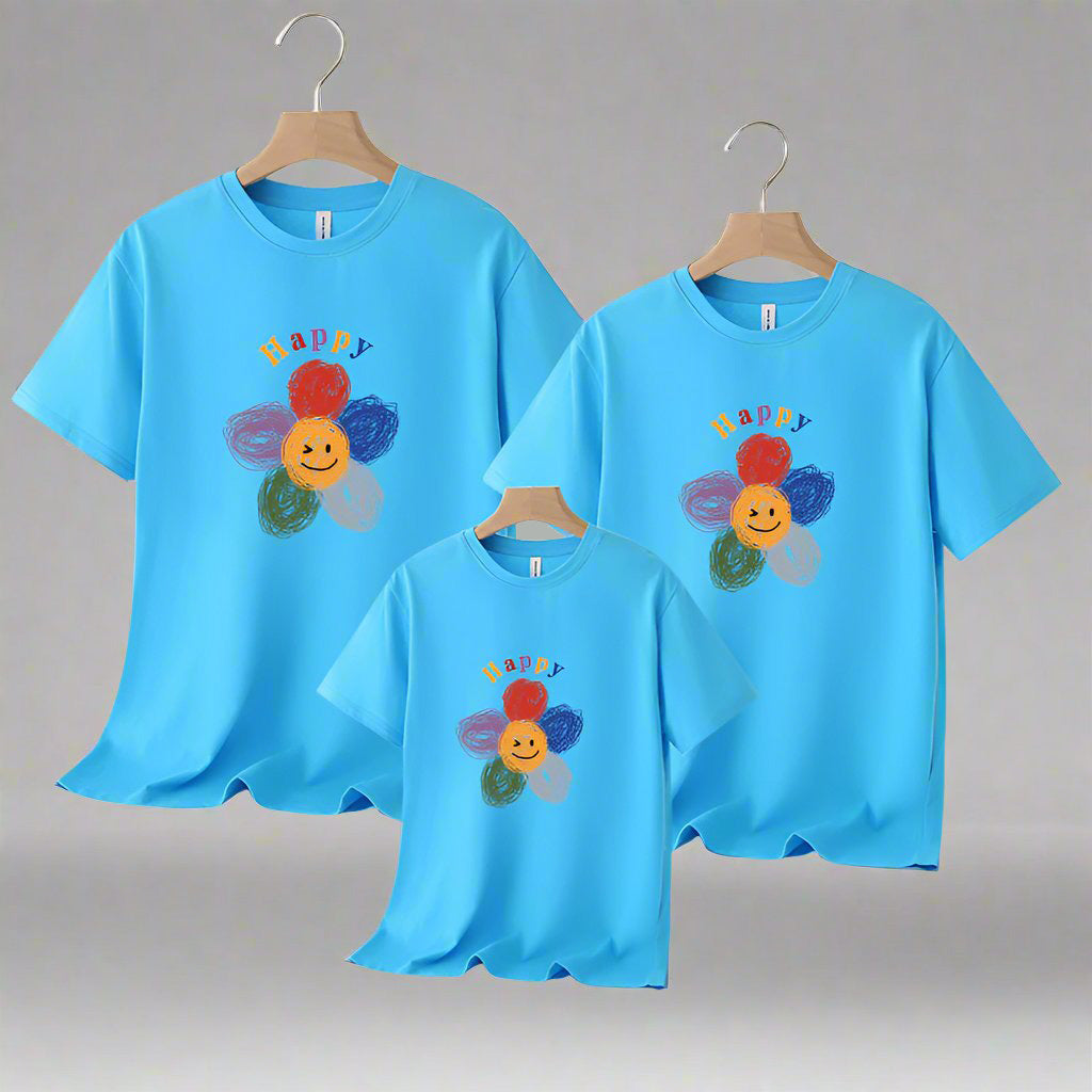 Family matching shirts with smiling flower design, available in multiple colors