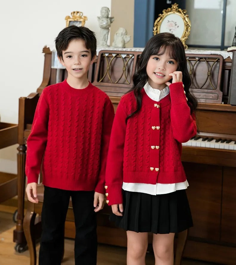 Coordinated family dressed in festive red cable knit sweaters, showcasing a warm and stylish holiday outfit