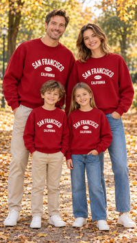 Family in matching burgundy sweatshirts with cream San Francisco California lettering on the chest.