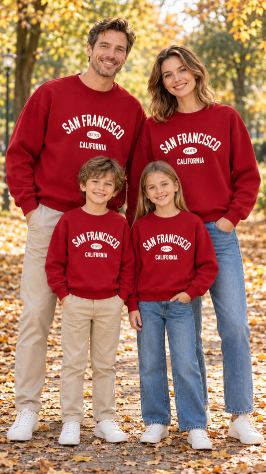 Family in matching burgundy sweatshirts with cream San Francisco California lettering on the chest.