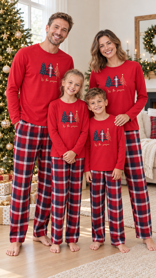 Family in matching red pajama tops with three plaid and gold Christmas trees, worn with navy and red plaid pants.