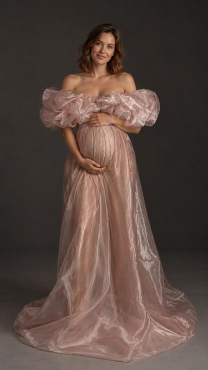 Pregnant woman in a dusty rose organza off-shoulder maternity gown with puffed sleeves in a photo studio