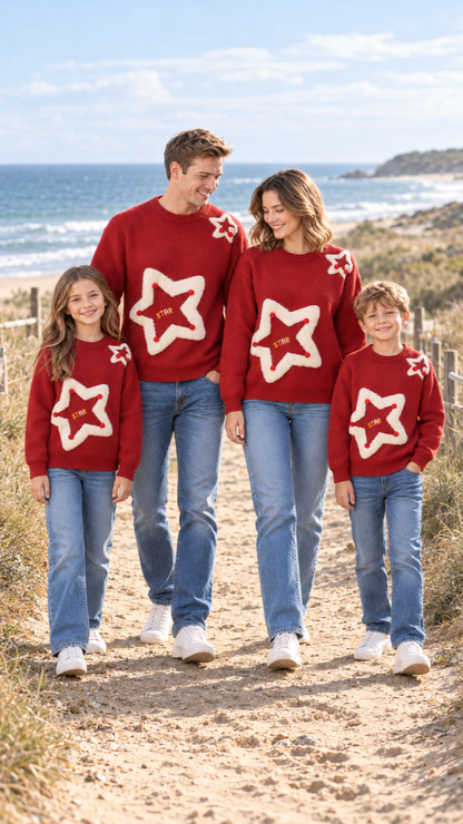 Family out together in matching Pom-Pom Star knit sweaters.