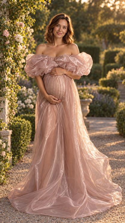 Maternity photoshoot outdoors at golden hour in a dusty rose organza gown with a short train