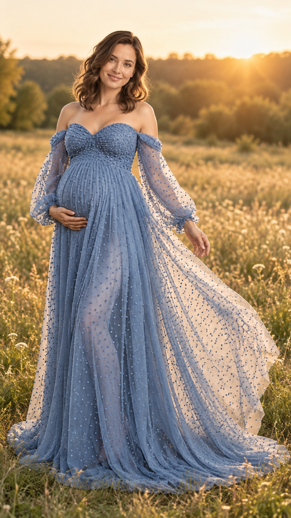 Maternity photoshoot outdoors at golden hour in a dusty blue dotted tulle gown