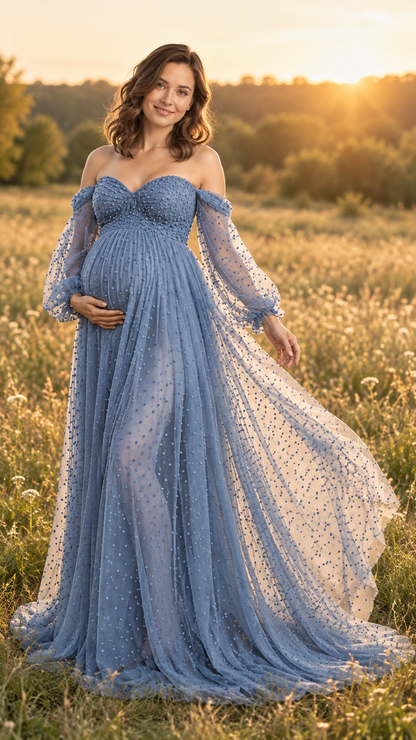 Maternity photoshoot outdoors at golden hour in a dusty blue dotted tulle gown