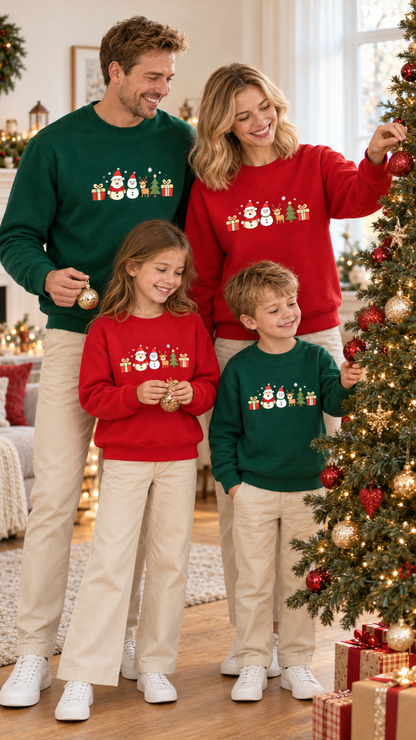 Family in matching Santa and Friends Christmas pajamas on Christmas morning by the tree.