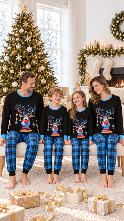Family in matching Blue Plaid Reindeer Christmas pajamas on Christmas morning by the tree.