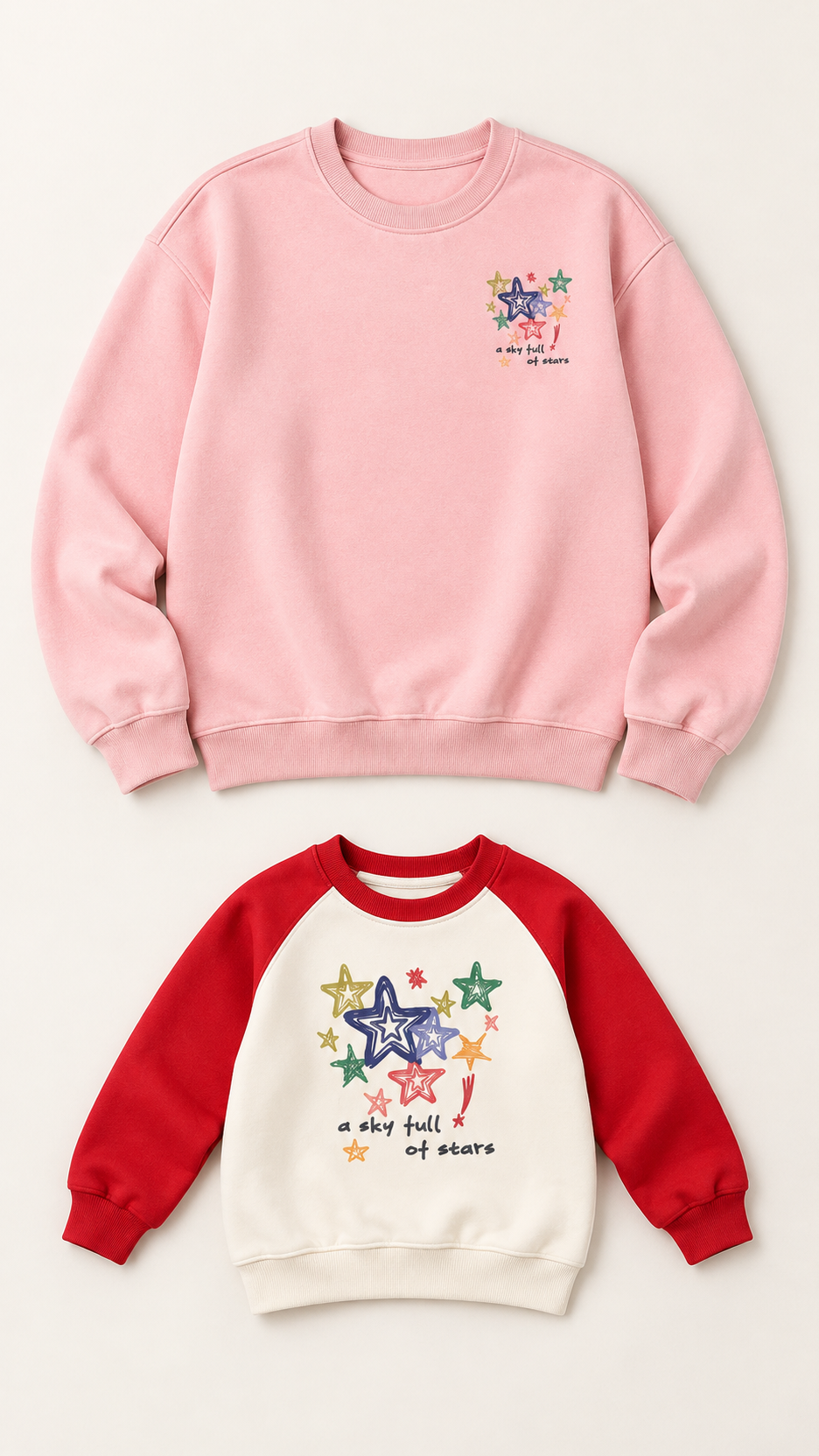 Starry Sky matching sweatshirts for an adult and a child, laid out without models.