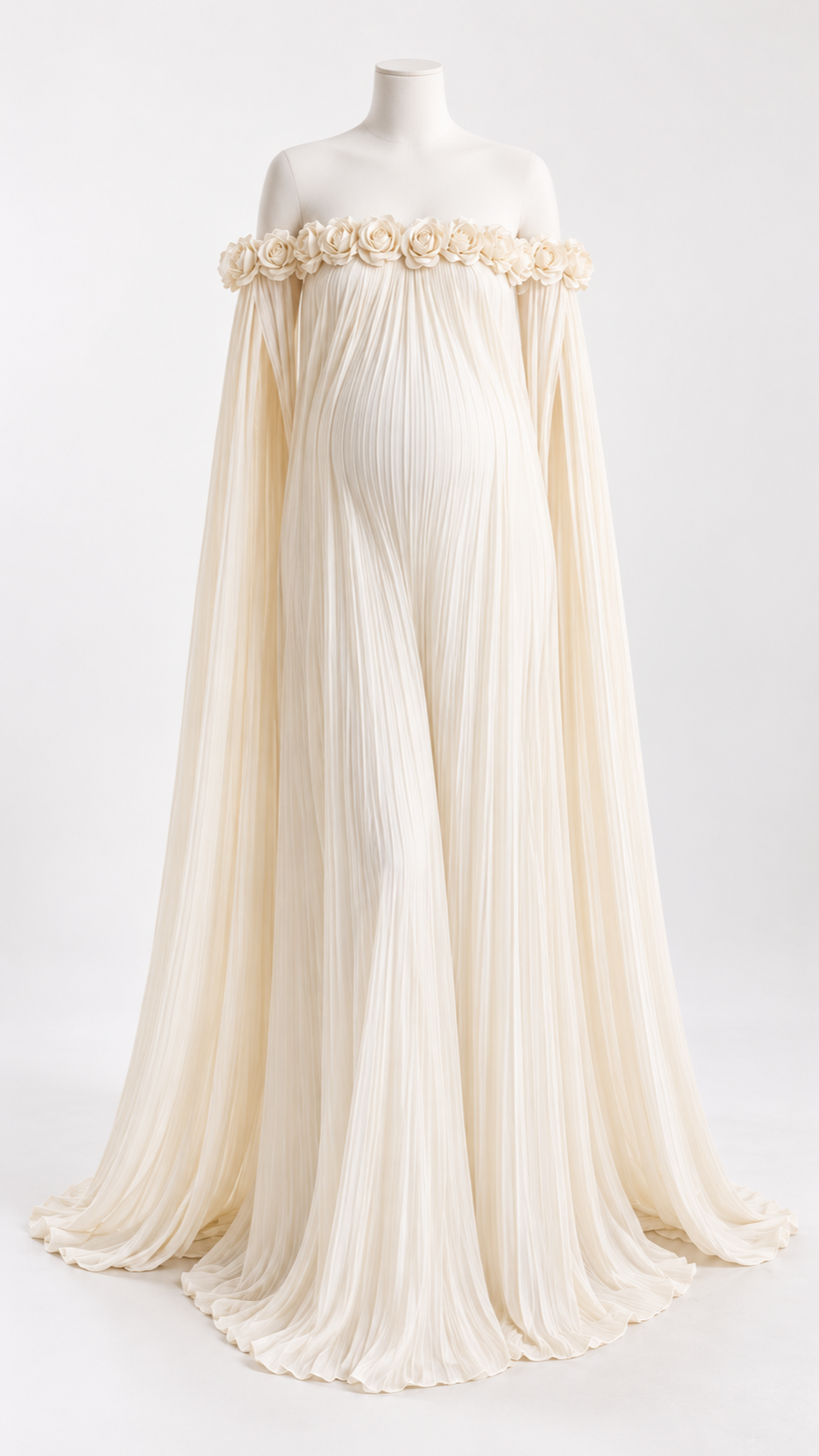 Ivory pleated off-shoulder maternity dress with a rosette neckline and draped shoulder panels