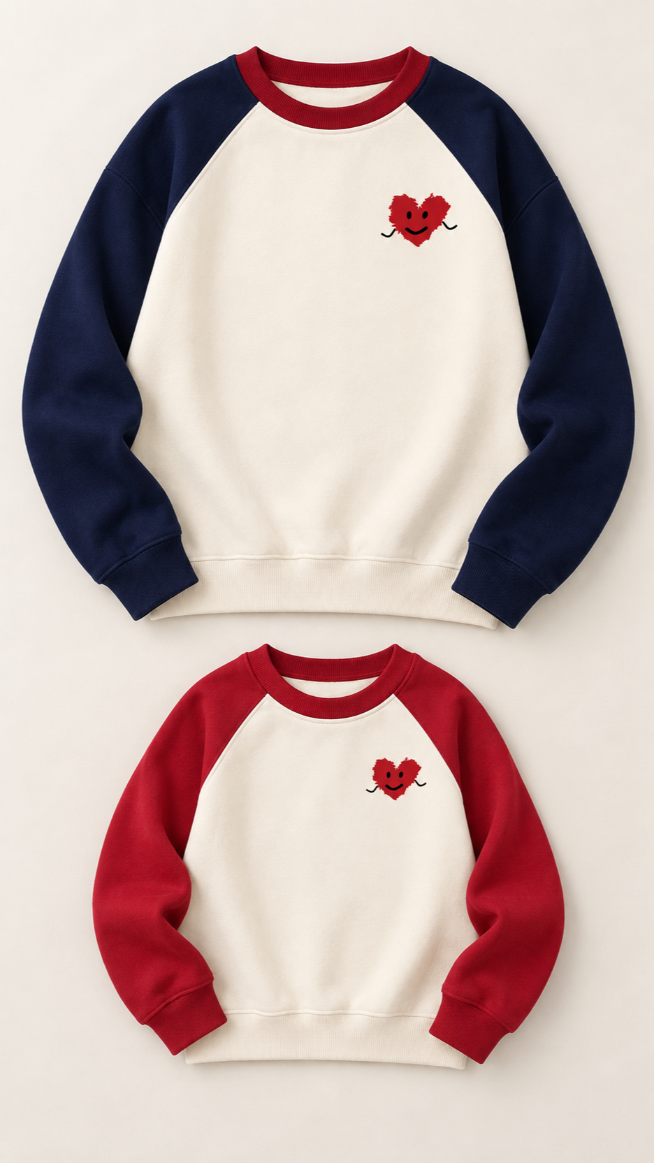 Smiley Heart matching sweatshirts for an adult and a child, laid out without models.