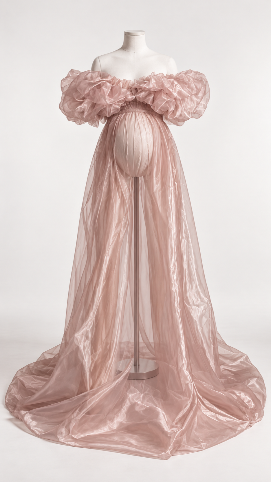 Dusty rose pearlescent organza maternity gown with puffed sleeves on a dress form