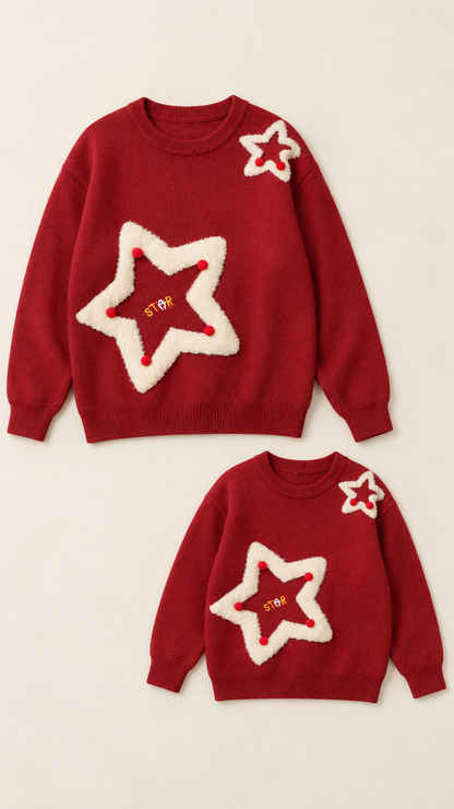 Pom-Pom Star matching knit sweaters for an adult and a child, laid out without models.