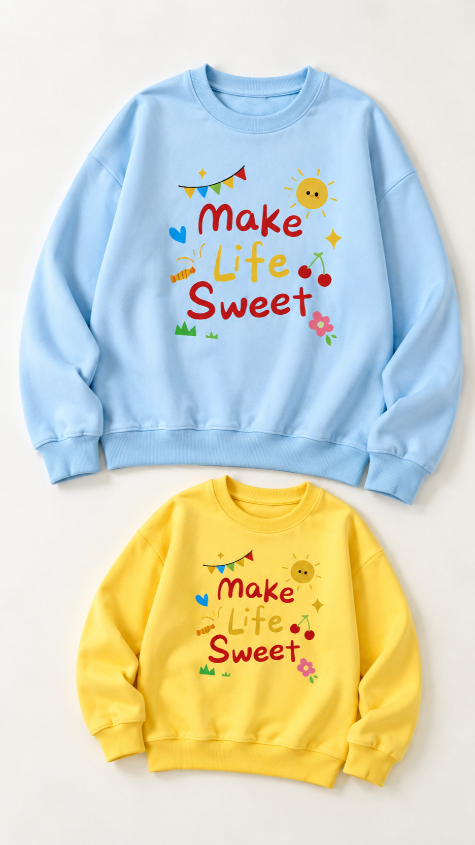Make Life Sweet matching sweatshirts for an adult and a child, laid out without models.