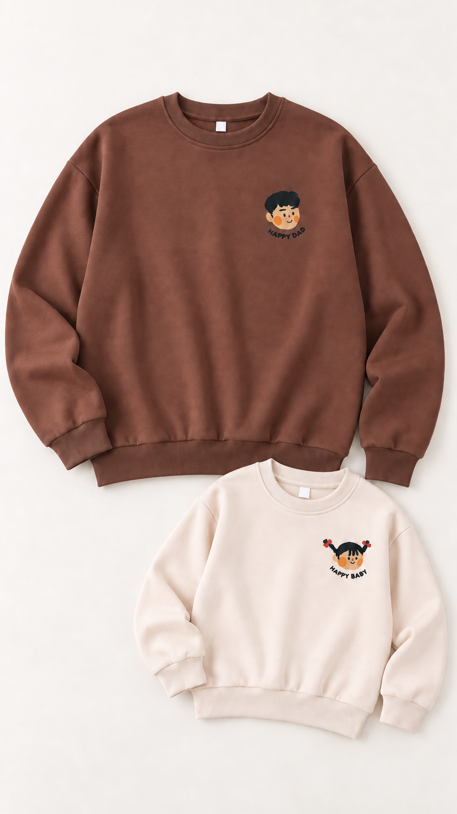 Happy Faces matching sweatshirts for an adult and a child, laid out without models.