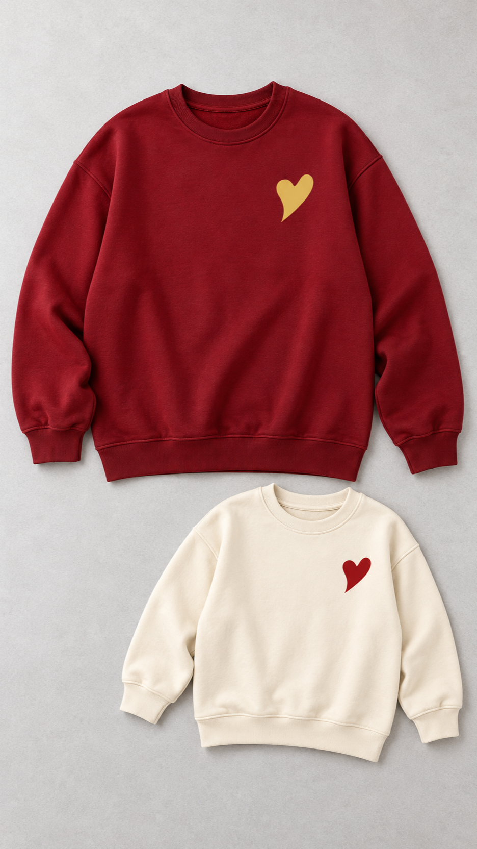 Little Heart matching sweatshirts for an adult and a child, laid out without models.