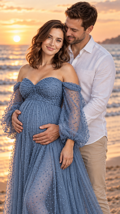 Expecting mother in a dusty blue tulle maternity gown with her partner