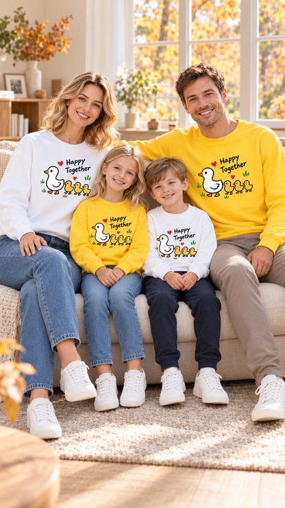 Family relaxing together at home in matching Duck Parade sweatshirts.