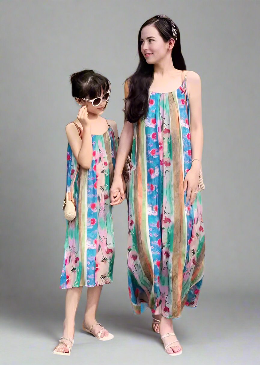 Mother and daughter wearing matching boho floral striped dresses
