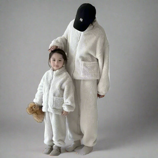 Cozy cream-colored matching loungewear outfits for mom and child, featuring zip-up jackets and soft pants