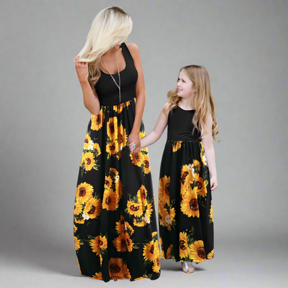 Mommy and me in sunflower maxi dresses, black and yellow color theme